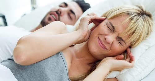 Portrait of woman who can not sleep because her husband snores.